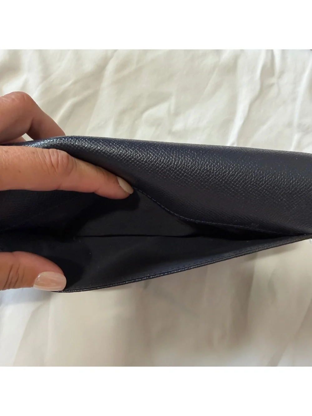 Coach Navy Leather Wallet with Multiple Card Slots and Zippered Compartments